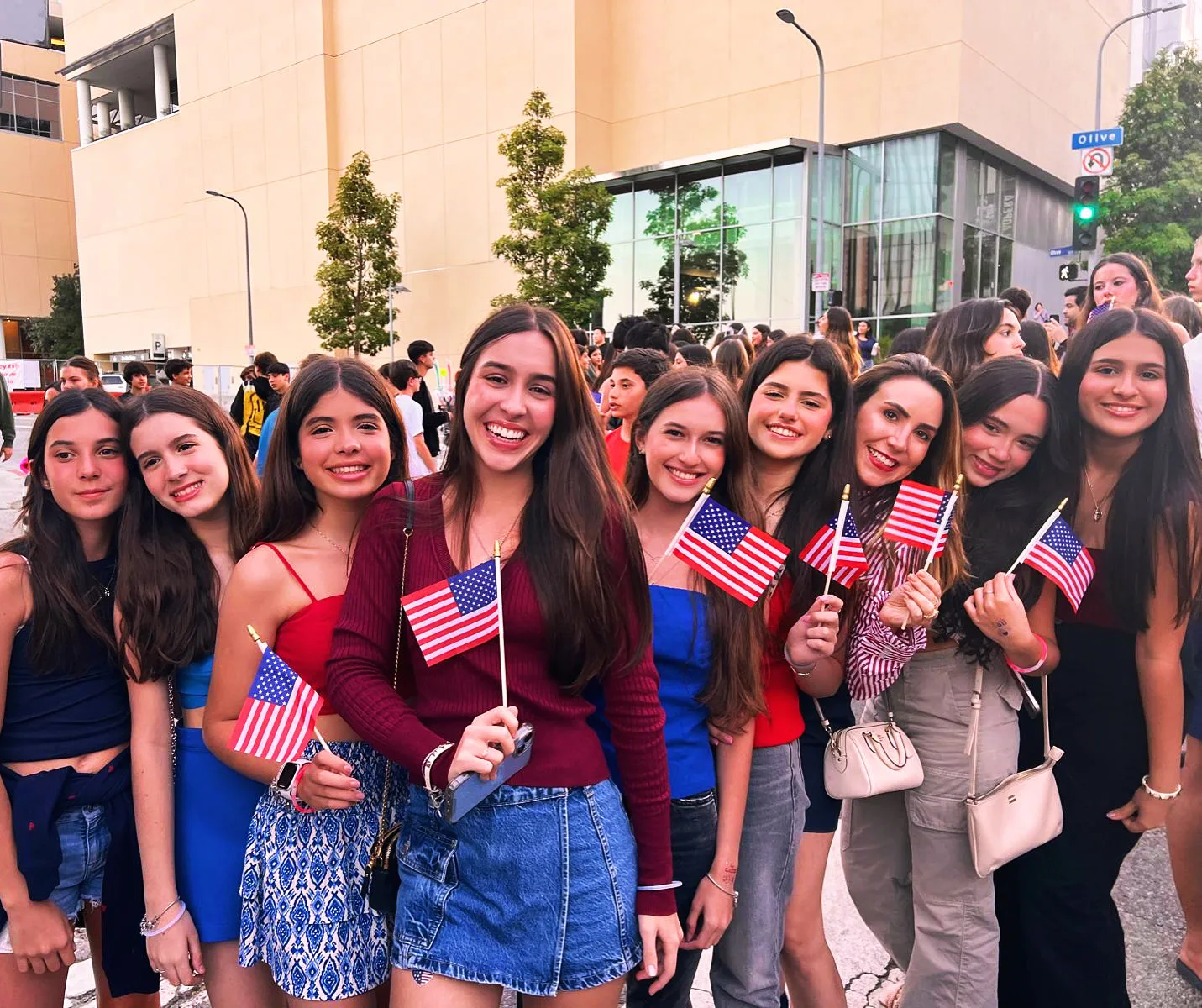 ELC students holding small American flags at a Fourth of July outing in Los Angeles