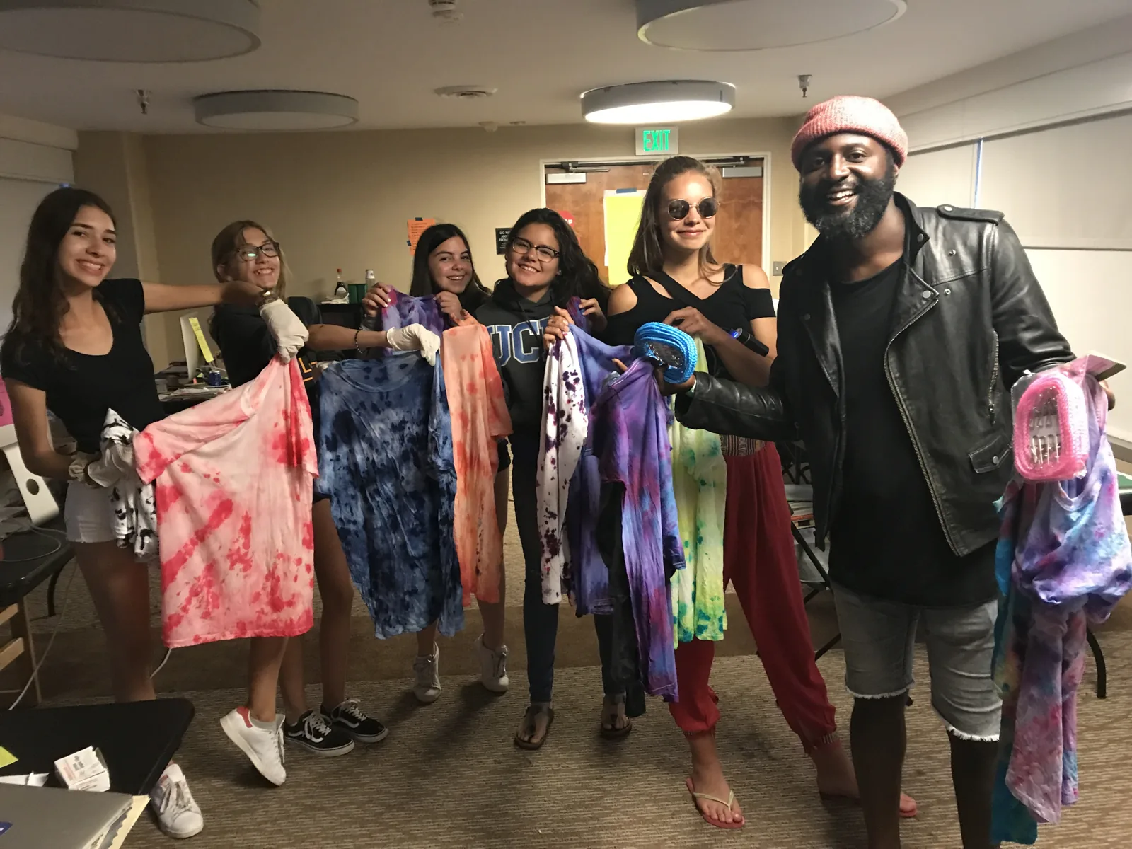 Students making tie-dye shirts at an afternoon activity