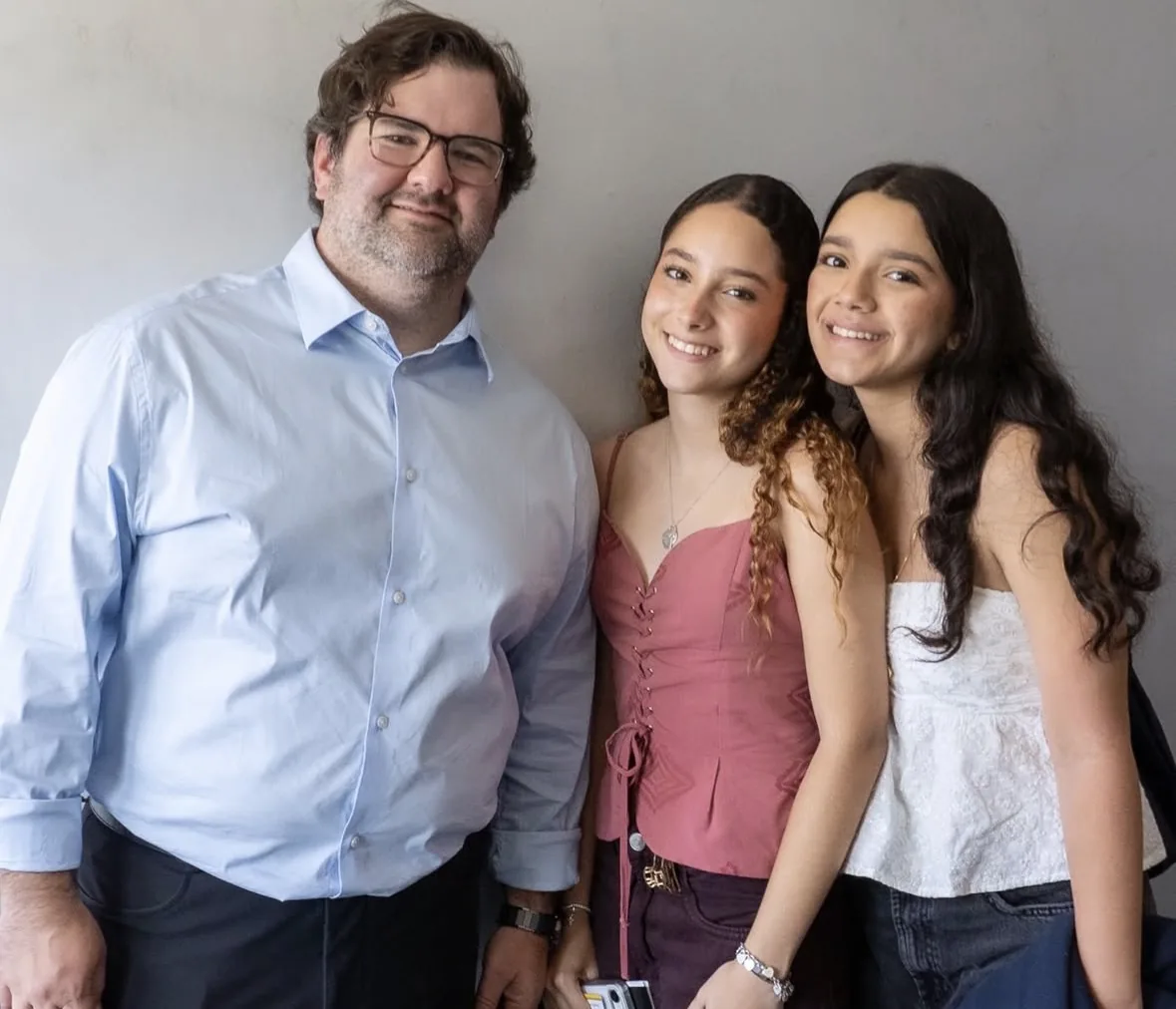 A guest speaker with two ELC students