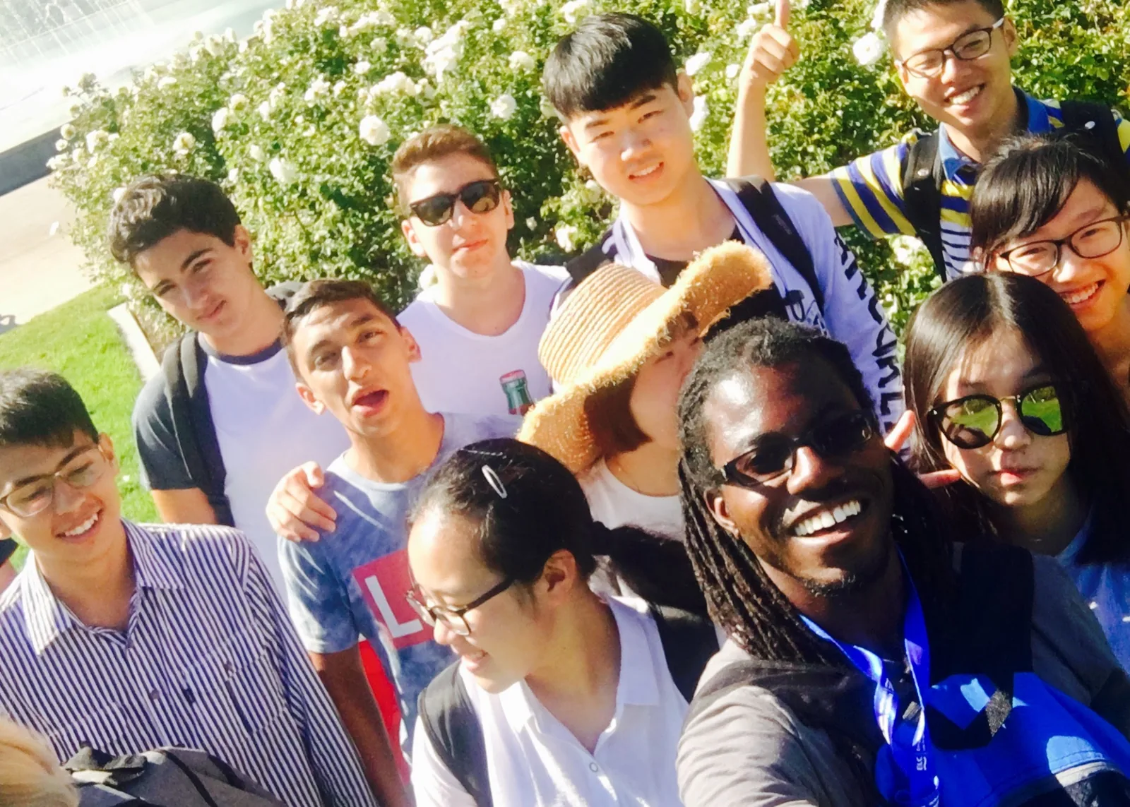 Staff and students taking a group selfie together