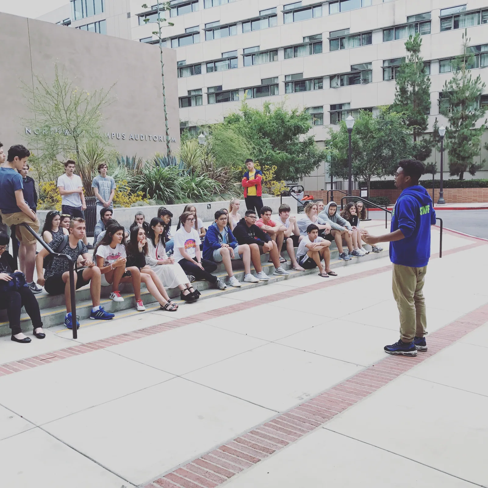 Staff welcoming new students at program orientation