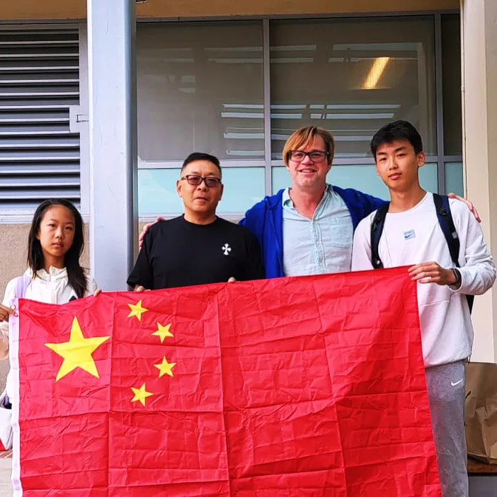 Students and ELC staff holding the Chinese flag on the UCLA campus