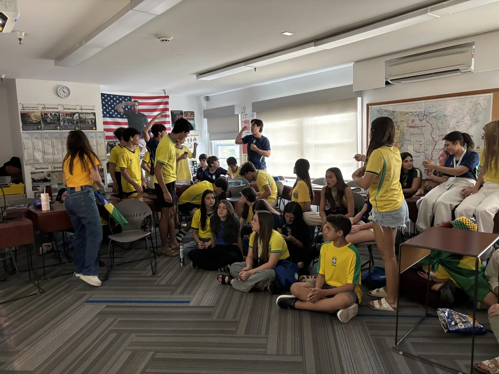 Students together in a flag-decorated classroom